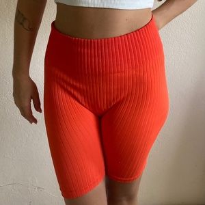 Bold orange biker shorts
